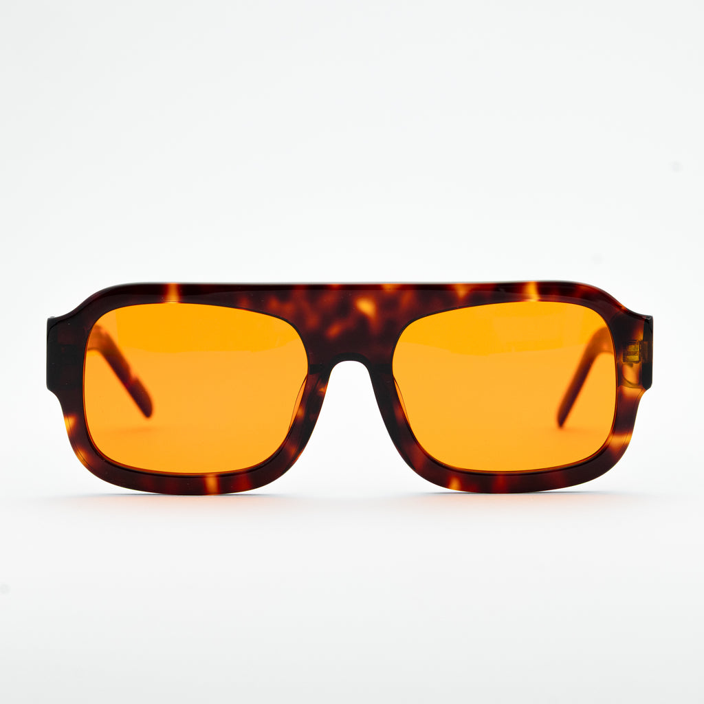 Good In Bed DYLAN blue light blocking glasses in Dark Tortoise, front-facing product shot with amber lenses