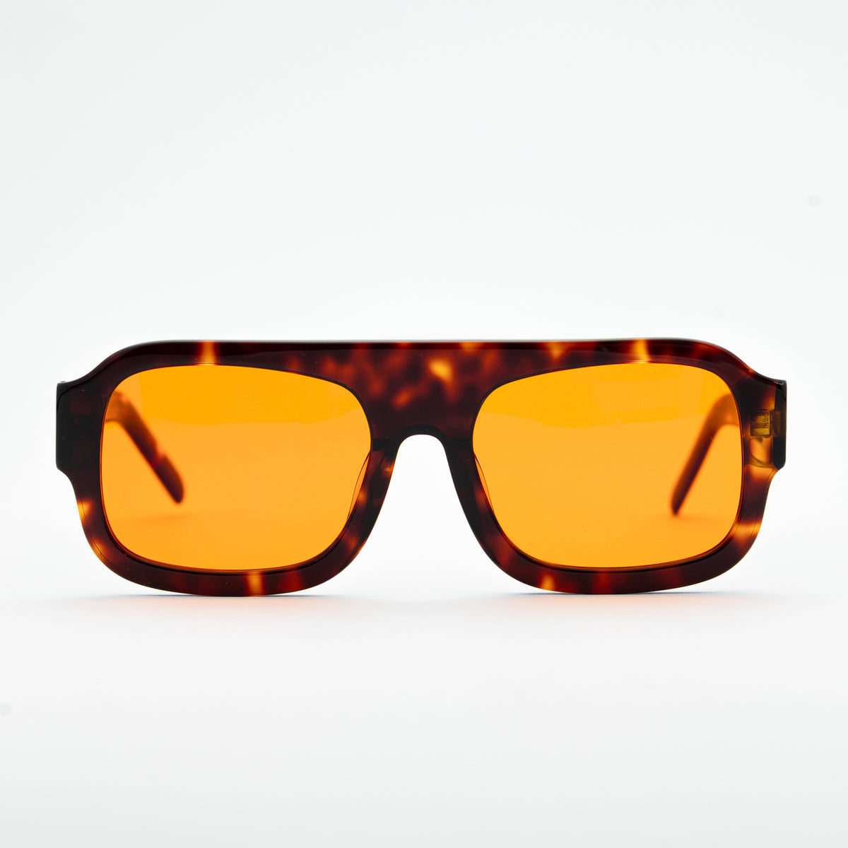 Good In Bed DYLAN blue light blocking glasses in Dark Tortoise, front-facing product shot with amber lenses