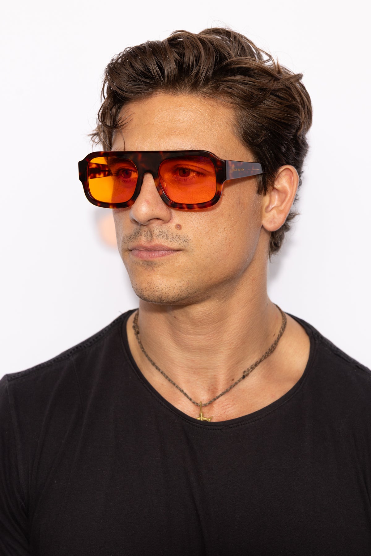 Man wearing Good In Bed DYLAN blue light blocking glasses in Dark Tortoise, front-facing lifestyle shot