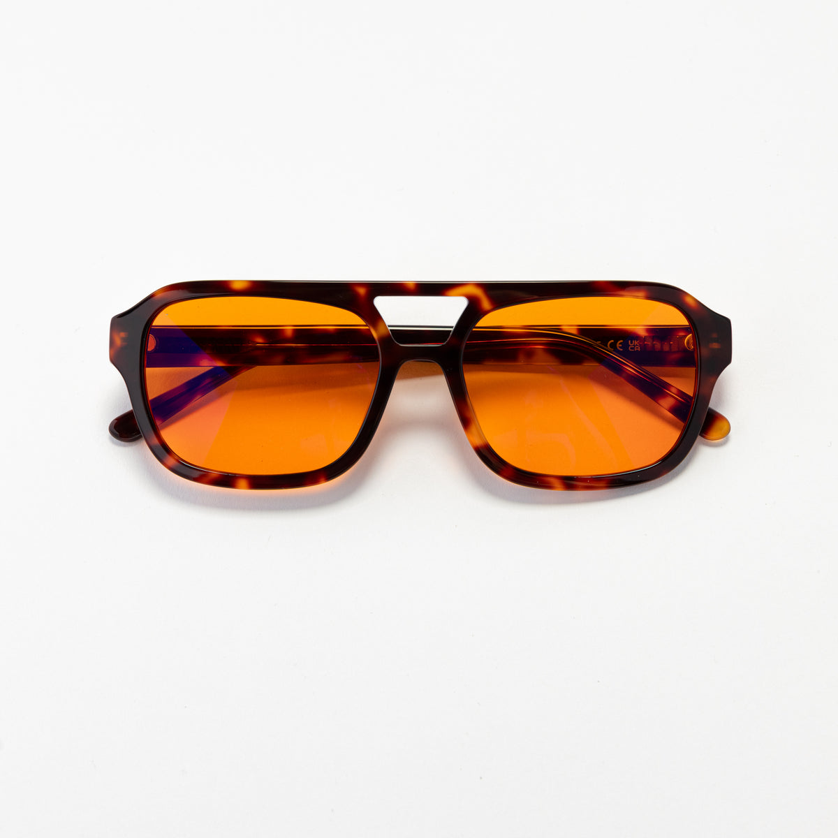 Good In Bed RILEY blue light blocking glasses in Dark Tortoise with amber OFF DUTY lenses, product flat lay