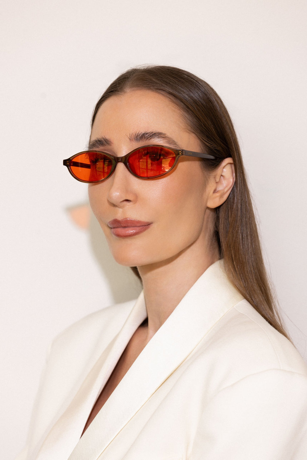 Kayla Barnes-Lentz wearing KAYLA x Good IN Bed red lens sleep glasses in Chocolate, DND lens blocks 99% of blue light, side profile