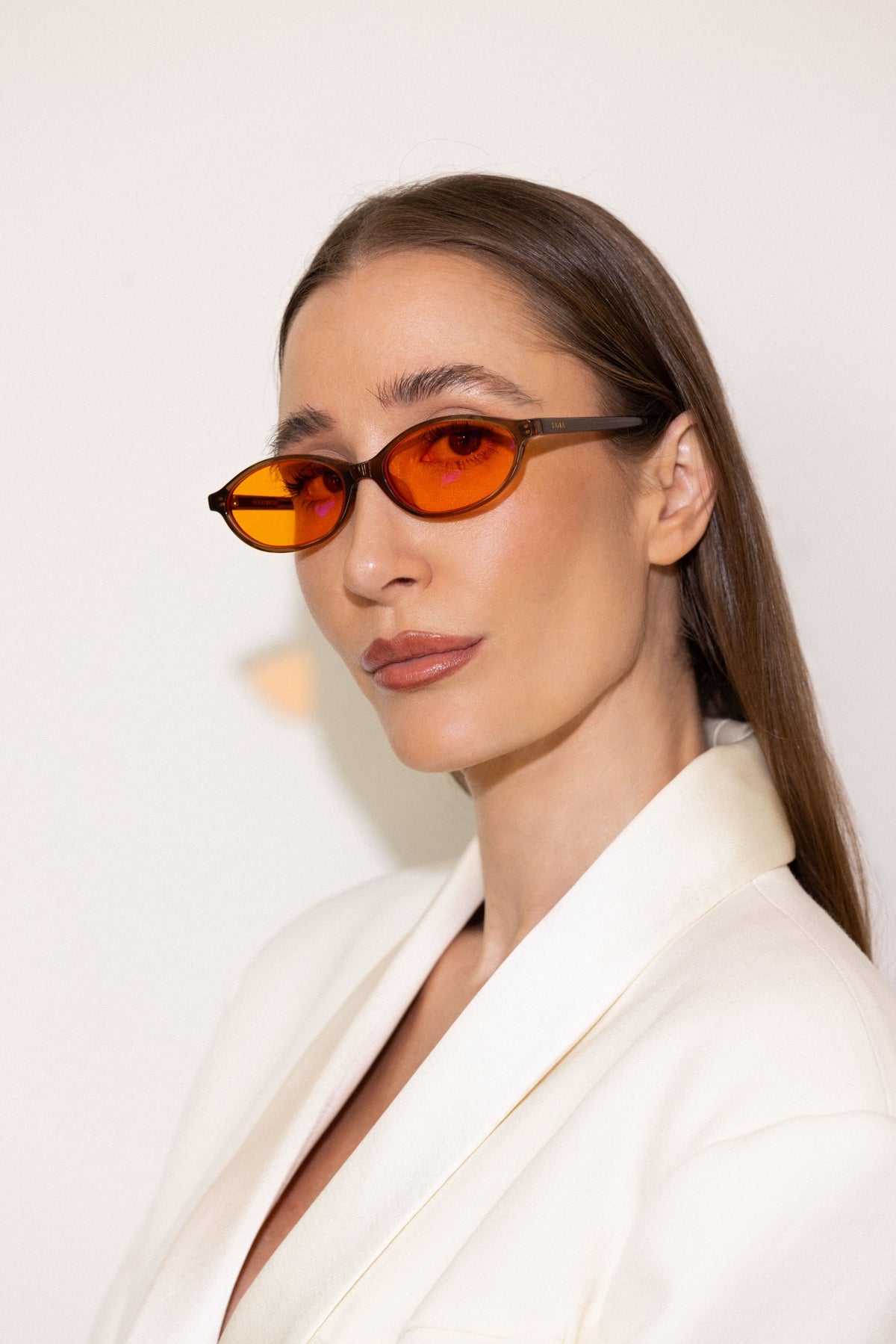 Kayla Barnes-Lentz wearing KAYLA x Good IN Bed blue light blocking glasses in Chocolate with amber Off Duty lens, side profile